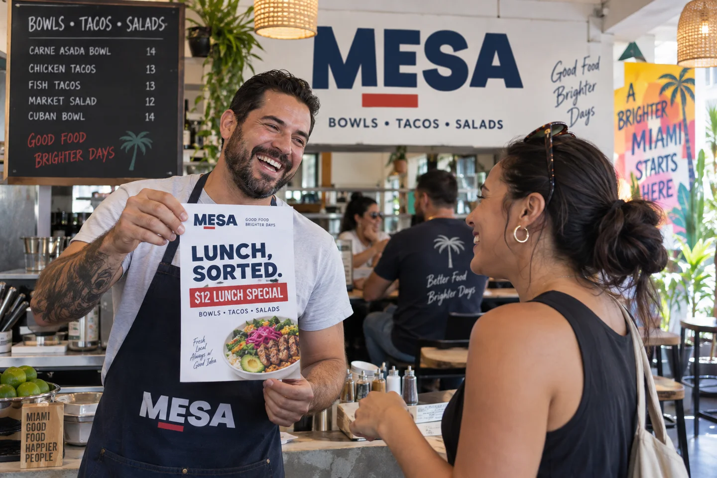 Mesa restaurant owner presenting a branded lunch promotion flyer
